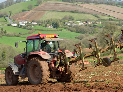 A red tractor in field