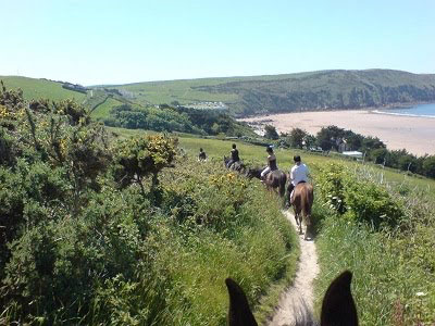 Horse treking along a coastal path